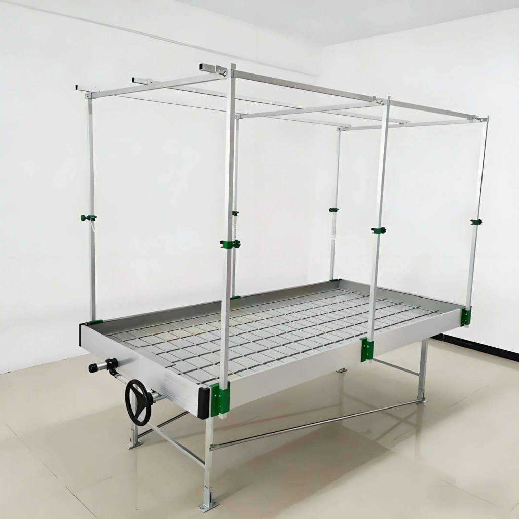 Ebb and flow flood bench with vertical support posts for grow lights and insect netting in greenhouse